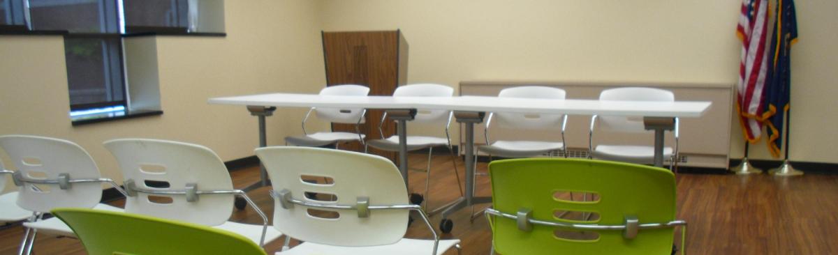 Room with chairs and tables.